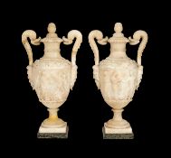 A LARGE PAIR OF 19TH CENTURY ITALIAN ALABASTER URNS AND COVERS IN THE STYLE OF PIRANESI