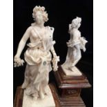 H.R.H PRINCESS MARGARET'S WEDDING GIFT: A PAIR OF 18TH CENTURY IVORY FIGURES OF SPRING AND AUTUMN