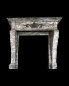 A 19TH CENTURY BRECCIA MARBLE CHIMNEYPIECE