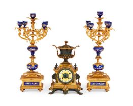 A LATE 19TH CENTURY BRONZE CLOCK GARNITURE IN THE STYLE OF BARBEDIENNE