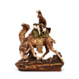 AN EARLY 20TH CENTURY ORIENTALIST PORCELAIN MODEL OF A LION HUNTER