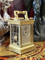 A LATE 19TH CENTURY FRENCH MINIATURE GILT BRASS CARRIAGE CLOCK