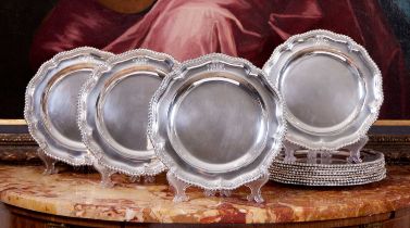 A SET OF TWELVE STERLING SILVER DINNER PLATES BY BENJAMIN SMITH III, LONDON, 1828