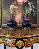 A PAIR OF EARLY 20TH CENTURY ORMOLU MOUNTED VASE LAMP BASES