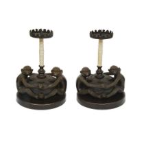 A PAIR OF MID 20TH CENTURY BRONZE AND CAMEL BONE MONKEY CANDLESTICKS