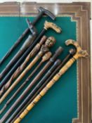 AN ECLECTIC GROUP OF TEN CARVED CANES AND STICKS