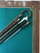 A JAPANESE MEIJI PERIOD SWORD STICK TOGETHER WITH FOUR FURTHER NOVELTY WALKING CANES