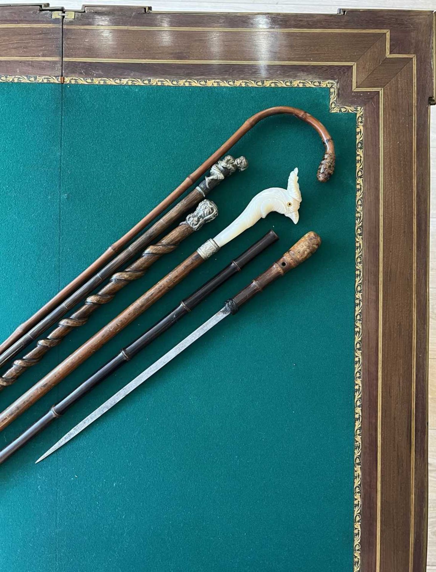 A JAPANESE MEIJI PERIOD SWORD STICK TOGETHER WITH FOUR FURTHER NOVELTY WALKING CANES