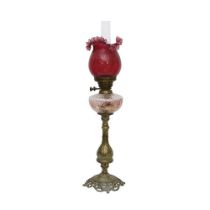 A 19TH CENTURY OIL LAMP WITH RUBY GLASS SHADE
