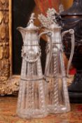 A PAIR OF LATE 19TH CENTURY SILVER MOUNTED CUT GLASS CLARET JUGS