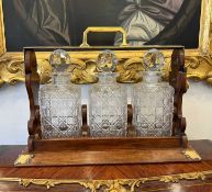 A LATE 19TH CENTURY OAK AND BRASS MOUNTED TANTALUS