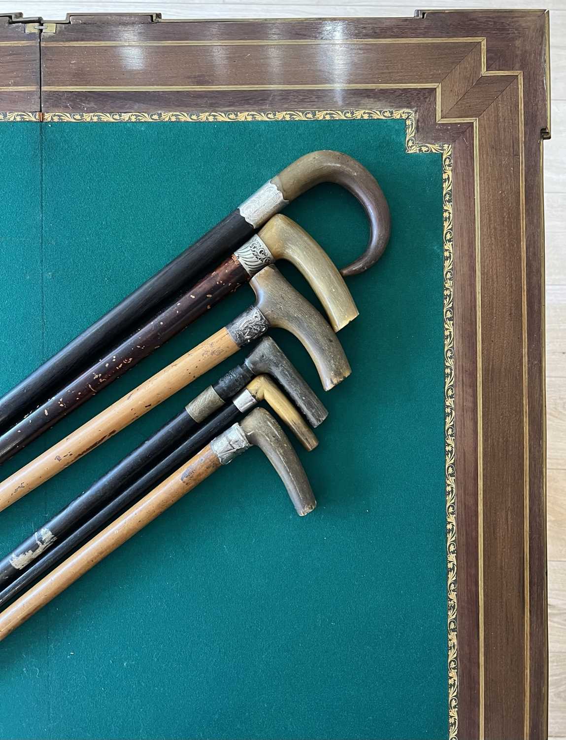 A LATE 19TH CENTURY RHINOCEROS HORN HANDLE CANE TOGETHER WITH FIVE FURTHER