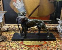 A MID 20TH CENTURY PATINATED SPELTER GROUP OF A HOUND AND PHEASANT