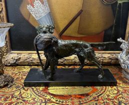 A MID 20TH CENTURY PATINATED SPELTER GROUP OF A HOUND AND PHEASANT