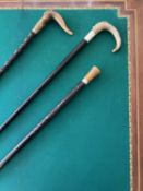 THREE LATE 19TH CENTURY WALKING CANES WITH EBONY SHAFTS