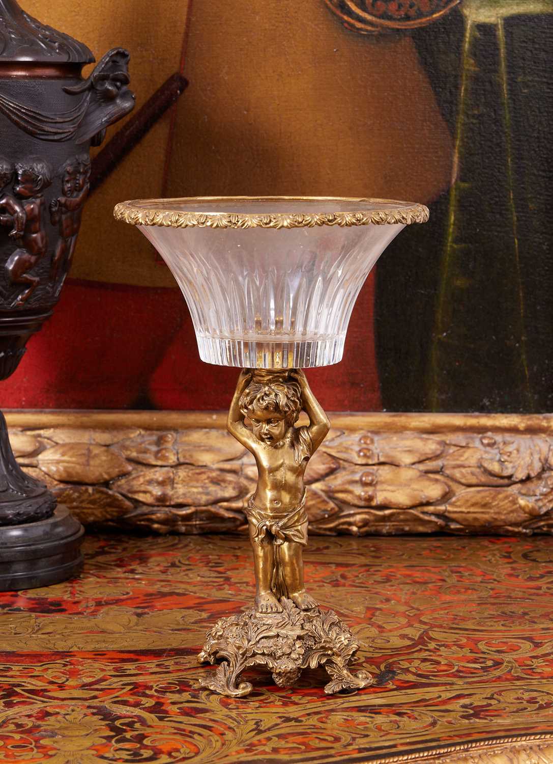 AN EMPIRE STYLE GILT BRONZE AND GLASS FIGURAL CENTREPIECE