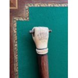 A RARE 19TH CENTURY CARVED WHALE TOOTH WALKING CANE OF MARITIME INTEREST