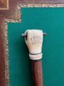 A RARE 19TH CENTURY CARVED WHALE TOOTH WALKING CANE OF MARITIME INTEREST