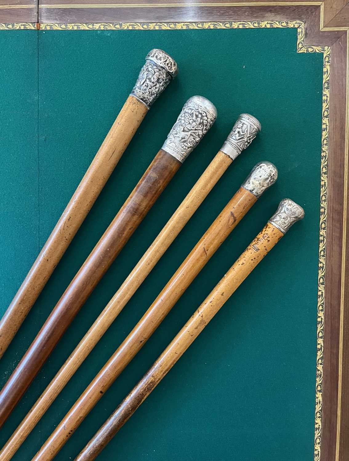 FIVE 19TH CENTURY CHINESE / SOUTH EAST ASIAN SILVER TOPPED WALKING CANES
