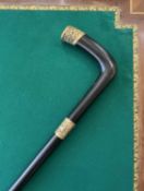 A 19TH CENTURY 18K GOLD AND EBONY WALKING STICK, 1880