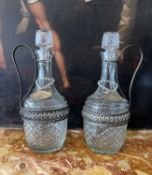 A PAIR OF PRESSED GLASS CLARET JUGS