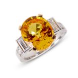 A YELLOW SAPPHIRE AND DIAMOND SET RING