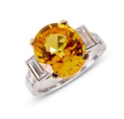 A YELLOW SAPPHIRE AND DIAMOND SET RING