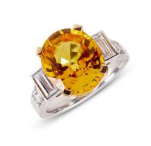 A YELLOW SAPPHIRE AND DIAMOND SET RING