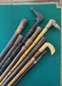 A COLLECTION OF EIGHT AFRICAN AND ASIAN WALKING STICKS AND CANES