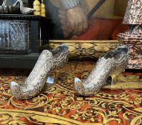 A PAIR OF LATE 19TH CENTURY SILVERED METAL MODELS OF SHOES