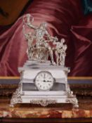 A SILVER MANTEL CLOCK DEPICTING LAOCOON AND HIS SONS