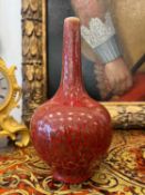 A 19TH CENTURY CHINESE RED GLAZED PORCELAIN BOTTLE VASE