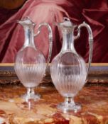 A FINE PAIR OF 19TH CENTURY FRENCH SILVER AND GLASS CLARET JUGS