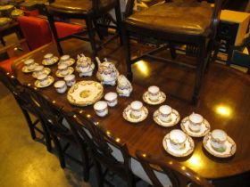 Victorian Rockingham Style Porcelain Tea and Coffee Service Gilded and Painted with Scenes