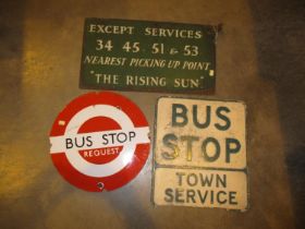 Two Bus Stop Signs and Another