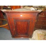 AN ANTIQUE OAK HANGING CORNER CUPBOARD