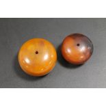 TWO LARGE AMBER TYPE BEADS