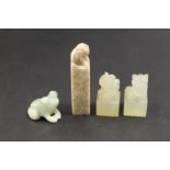 TWO MINIATURE MODERN JADE DOGS OF FO, TOGETHER WITH A CARVED HARDSTONE SEAL AND A MINIATURE FROG (