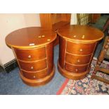 A PAIR OF MODERN CIRCULAR THREE DRAWER BEDSIDE CHESTS DIA. 54 CM (2)