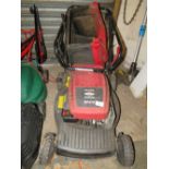 A PETROL MOWER WITH BOX - BRIGGS & STRATTON ENGINE