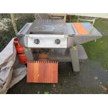 AN OUTBACK GAS BARBECUE, TOOLS AND ACCESSORIES