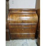 A 19TH CENTURY BIEDERMEIER STYLE MAHOGANY CYLINDER BUREAU HAVING A FITTED INTERIOR, the pull-out