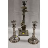 A GRECO ROMAN STYLE SILVER PLATED LAMP BASE TOGETHER WITH A PAIR OF SILVER PLATED CANDLESTICKS