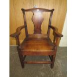 AN ANTIQUE OAK LARGE OPEN ARMCHAIR