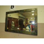 AN ARTS AND CRAFTS STYLE RECTANGULAR WALL MIRROR 51 X 75 CM