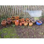 A LARGE QUANTITY OF ASSORTED TERRACOTTA AND GLAZED GARDEN PLANTERS