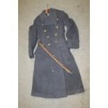 TWO VINTAGE SWAGGER STICKS TOGETHER WITH A VINTAGE RAF GREATCOAT IN WORN CONDITION