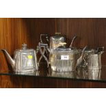 A SILVER PLATED ANTIQUE FOUR PIECE TEA AND COFFEE SERVICE DATED JANUARY 22ND 1895 TOGETHER WITH