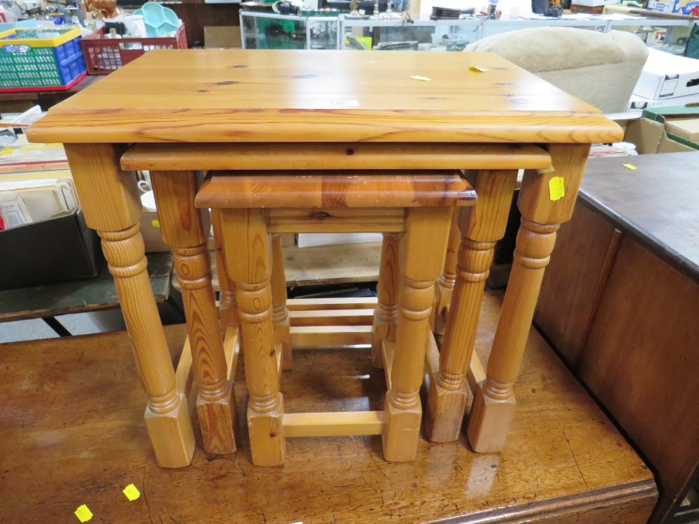 A HONEY PINE NEST OF THREE TABLES