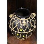 A LARGE FOUR HANDLED VASE WITH WICKER WORK EMBELLISHMENT